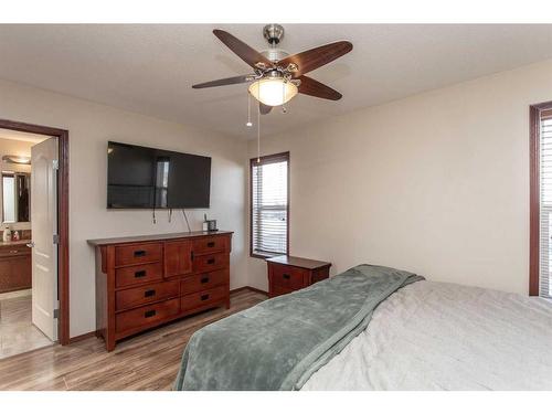 56 Lodge Place, Sylvan Lake, AB - Indoor Photo Showing Bedroom