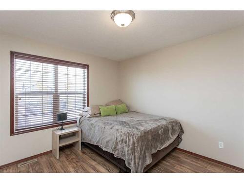 56 Lodge Place, Sylvan Lake, AB - Indoor Photo Showing Bedroom