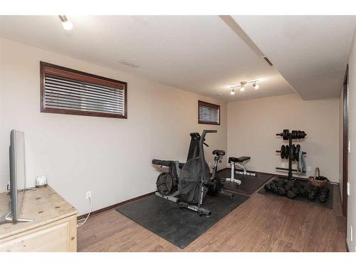 56 Lodge Place, Sylvan Lake, AB - Indoor Photo Showing Gym Room