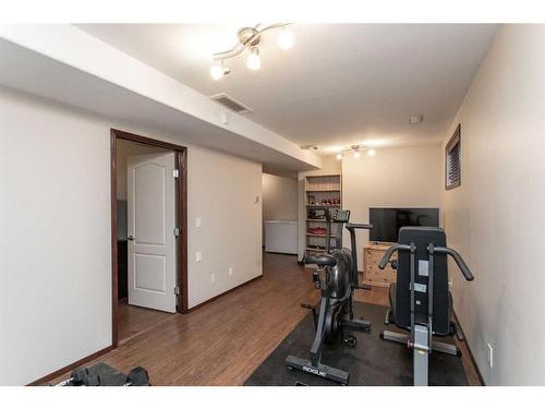 56 Lodge Place, Sylvan Lake, AB - Indoor Photo Showing Gym Room