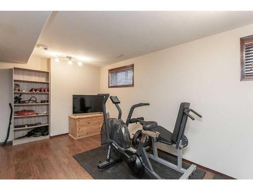 56 Lodge Place, Sylvan Lake, AB - Indoor Photo Showing Gym Room