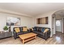 56 Lodge Place, Sylvan Lake, AB  - Indoor Photo Showing Living Room 