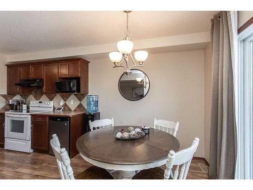 56 Lodge Place, Sylvan Lake, AB - Indoor Photo Showing Dining Room