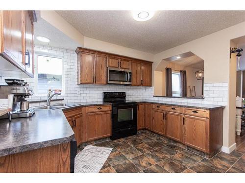 139 Timberstone Way, Red Deer, AB - Indoor Photo Showing Kitchen With Double Sink