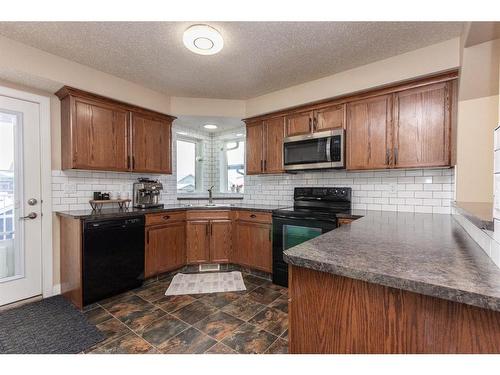 139 Timberstone Way, Red Deer, AB - Indoor Photo Showing Kitchen With Double Sink