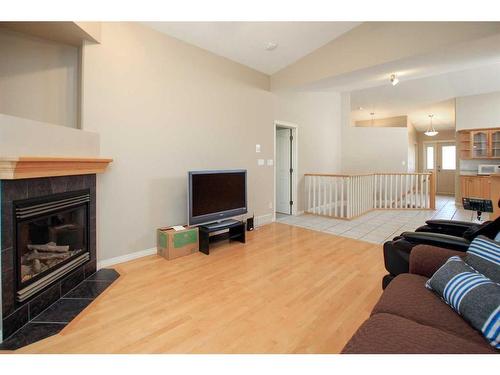 94 Ainsworth Crescent, Red Deer, AB - Indoor Photo Showing Living Room With Fireplace