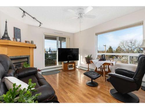 308-4834 52A Street, Camrose, AB - Indoor Photo Showing Living Room With Fireplace