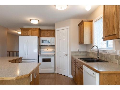 6440 Elmwood Way, Innisfail, AB - Indoor Photo Showing Kitchen With Double Sink