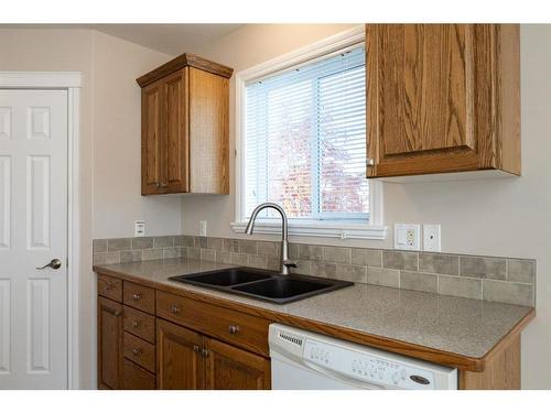 6440 Elmwood Way, Innisfail, AB - Indoor Photo Showing Kitchen With Double Sink