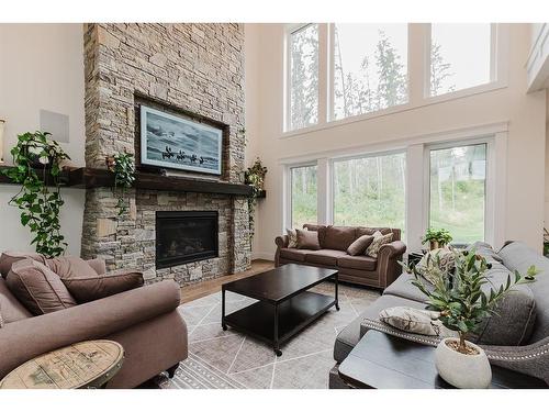 132-27111 Highway 597, Rural Lacombe County, AB - Indoor Photo Showing Living Room With Fireplace