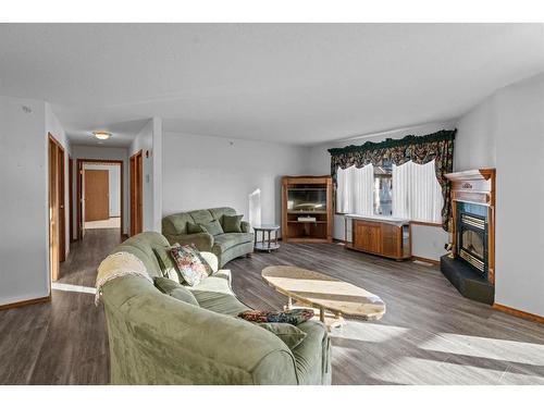 301-5402 50 Avenue, Stettler, AB - Indoor Photo Showing Living Room With Fireplace