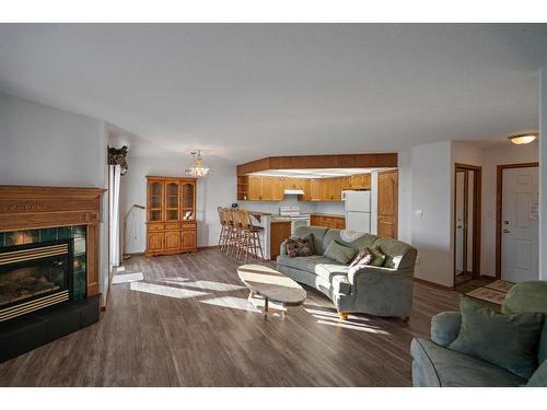 301-5402 50 Avenue, Stettler, AB - Indoor Photo Showing Living Room With Fireplace