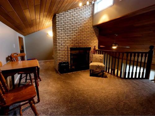 3920 39 Street Close, Ponoka, AB - Indoor With Fireplace