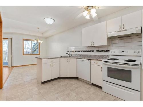 5322 58 Street Close, Camrose, AB - Indoor Photo Showing Kitchen With Double Sink