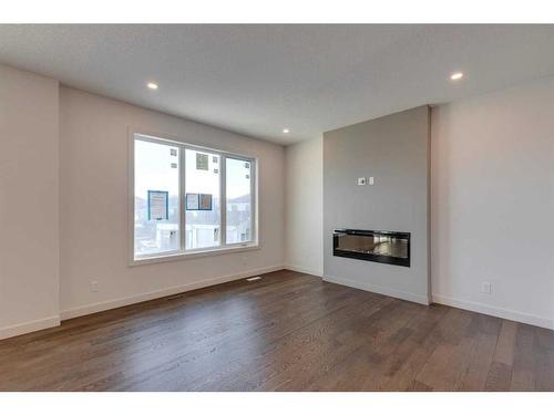 152 Sage Hill Heights Nw, Calgary, AB - Indoor Photo Showing Living Room With Fireplace