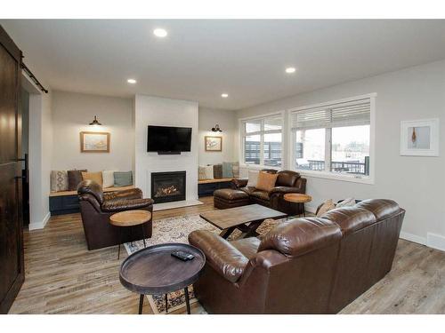 652 Bridgeview Road, Rural Ponoka County, AB - Indoor Photo Showing Living Room With Fireplace