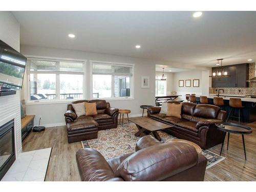 652 Bridgeview Road, Rural Ponoka County, AB - Indoor Photo Showing Living Room With Fireplace