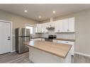 2 Cascade Street, Blackfalds, AB  - Indoor Photo Showing Kitchen With Stainless Steel Kitchen With Double Sink 