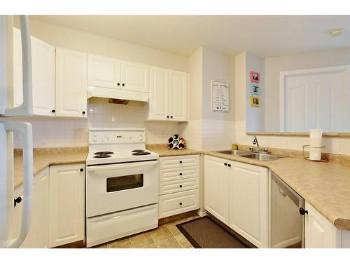 1314-12A Ironside Street, Red Deer, AB - Indoor Photo Showing Kitchen With Double Sink