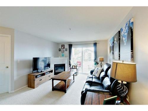 1314-12A Ironside Street, Red Deer, AB - Indoor Photo Showing Living Room With Fireplace