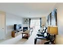 1314-12A Ironside Street, Red Deer, AB  - Indoor Photo Showing Living Room With Fireplace 