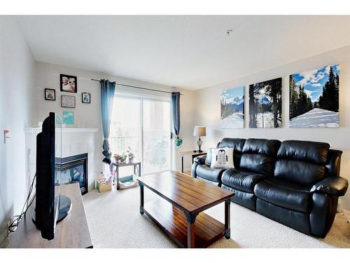 1314-12A Ironside Street, Red Deer, AB - Indoor Photo Showing Living Room With Fireplace