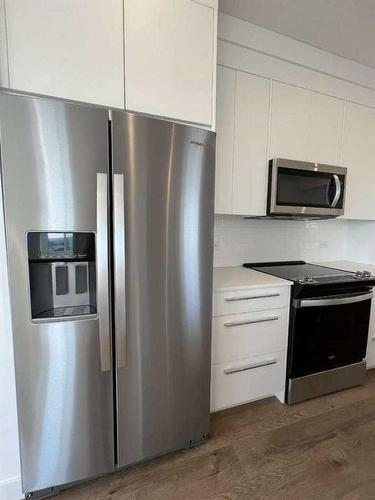 4408-111 Wolf Creek Drive, Calgary, AB - Indoor Photo Showing Kitchen With Stainless Steel Kitchen