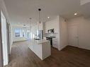 4408-111 Wolf Creek Drive, Calgary, AB  - Indoor Photo Showing Kitchen With Stainless Steel Kitchen With Double Sink With Upgraded Kitchen 