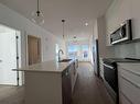 4408-111 Wolf Creek Drive, Calgary, AB  - Indoor Photo Showing Kitchen With Double Sink With Upgraded Kitchen 