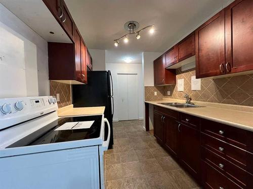 102-7164 Parke Avenue, Red Deer, AB - Indoor Photo Showing Kitchen With Double Sink