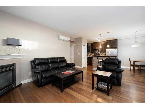 101-9919 Gordon Avenue, Fort Mcmurray, AB - Indoor Photo Showing Living Room With Fireplace