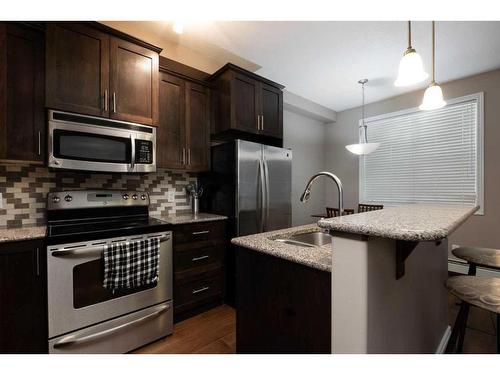 101-9919 Gordon Avenue, Fort Mcmurray, AB - Indoor Photo Showing Kitchen With Double Sink With Upgraded Kitchen