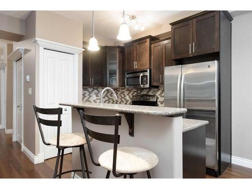 101-9919 Gordon Avenue, Fort Mcmurray, AB - Indoor Photo Showing Kitchen With Upgraded Kitchen