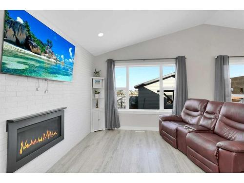 38 Valmont Street, Blackfalds, AB - Indoor Photo Showing Living Room With Fireplace