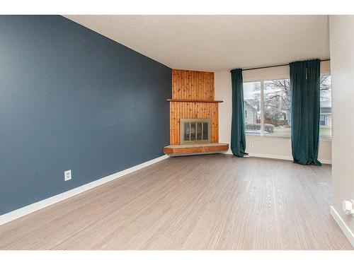 5007 58 Street, Lacombe, AB - Indoor With Fireplace