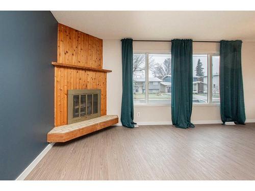 5007 58 Street, Lacombe, AB - Indoor With Fireplace