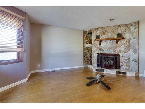 5741 35 Street, Red Deer, AB - Indoor Photo Showing Other Room With Fireplace