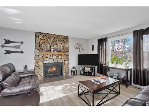 5608 56A Avenue, Rocky Mountain House, AB - Indoor Photo Showing Living Room With Fireplace