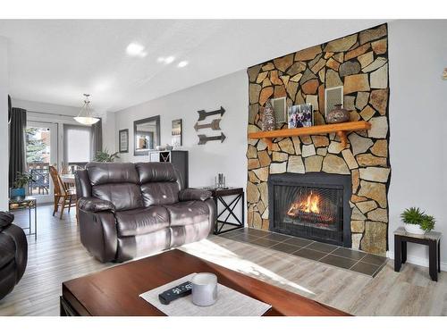 5608 56A Avenue, Rocky Mountain House, AB - Indoor Photo Showing Living Room With Fireplace