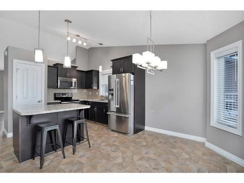 656 Robinson Avenue, Penhold, AB - Indoor Photo Showing Kitchen With Upgraded Kitchen