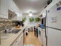 102-4904 54 Street West, Red Deer, AB  - Indoor Photo Showing Kitchen With Double Sink 