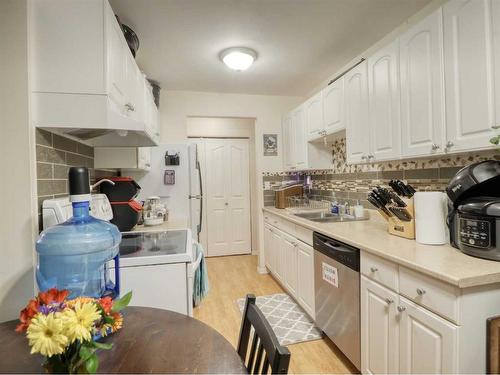 102-4904 54 Street West, Red Deer, AB - Indoor Photo Showing Kitchen With Double Sink