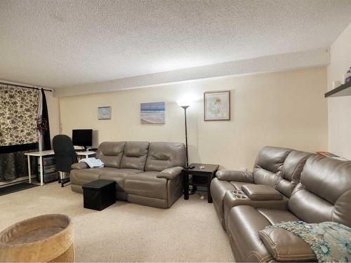 102-4904 54 Street West, Red Deer, AB - Indoor Photo Showing Living Room