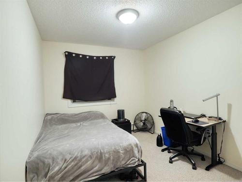 102-4904 54 Street West, Red Deer, AB - Indoor Photo Showing Bedroom