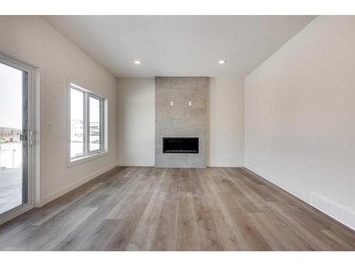 12 Ian Way, Sylvan Lake, AB - Indoor Photo Showing Living Room With Fireplace