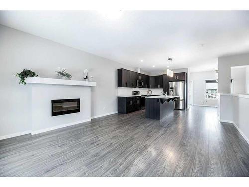 33 Athens Road, Blackfalds, AB - Indoor Photo Showing Living Room With Fireplace