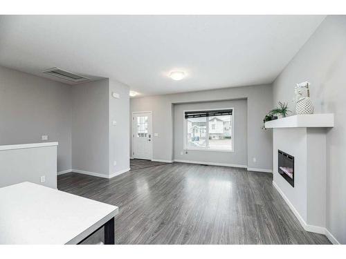 33 Athens Road, Blackfalds, AB - Indoor Photo Showing Other Room With Fireplace