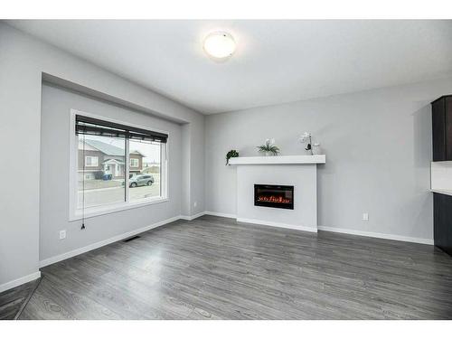 33 Athens Road, Blackfalds, AB - Indoor Photo Showing Living Room With Fireplace