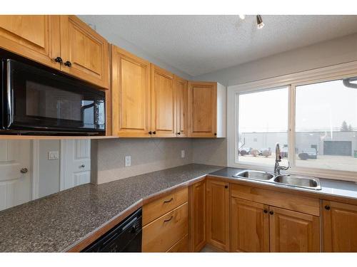 4515 48 Street, Innisfail, AB - Indoor Photo Showing Kitchen With Double Sink