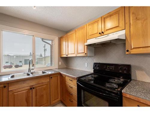 4515 48 Street, Innisfail, AB - Indoor Photo Showing Kitchen With Double Sink